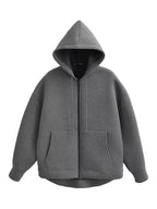 Oversized zip-up hoodie in dark grey with front patch pockets, drawstring hood and ribbed hem, flat lay front view