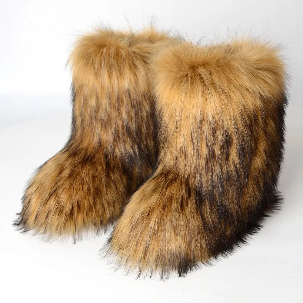 Pair of tan and dark-streaked fluffy faux fur ankle boots on a white background, product shot