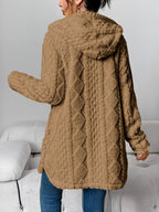 Back view of the camel brown hooded cardigan showing the diamond relief pattern, centre-back seam, hood, relaxed sleeves and button closures at the lower side seams